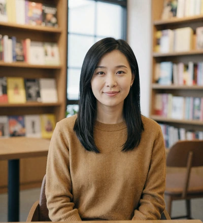 Asian woman reading in a bookstore café, a verified profile on our aviator dating site