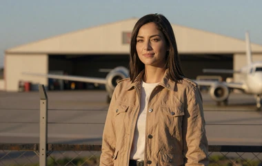 Woman near an airfield at golden hour on the military pilot dating category