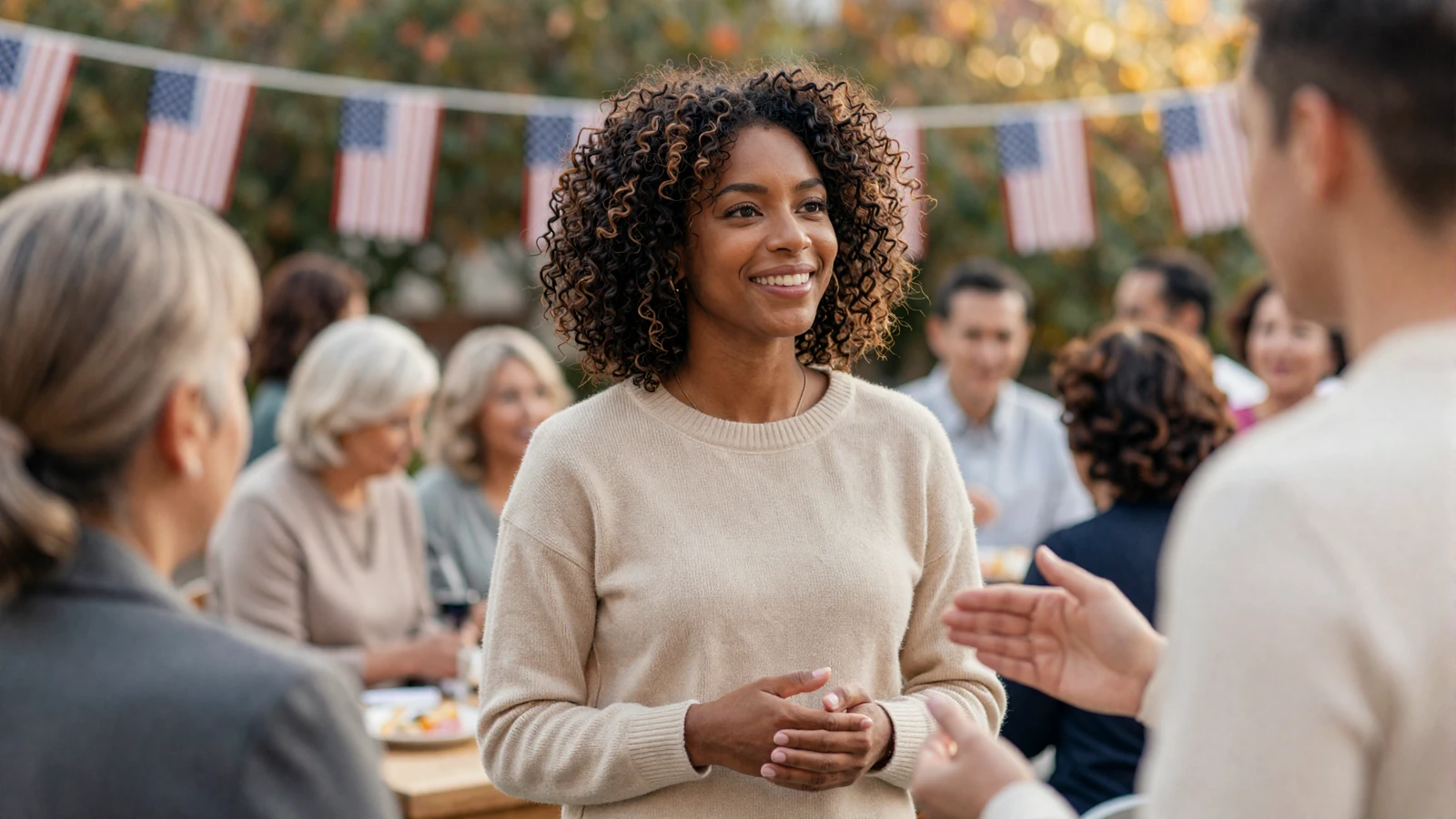 Black woman smiling warmly at an outdoor veteran community event, welcoming members to our veteran dating site