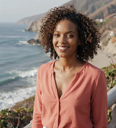 Black woman near a coastal overlook, a verified aviation singles dating member seeking love
